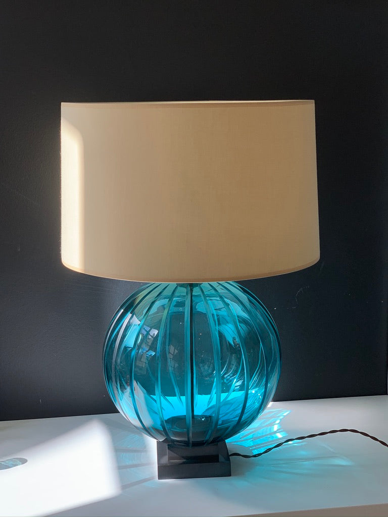 Single Ball Table Lamp against a wall