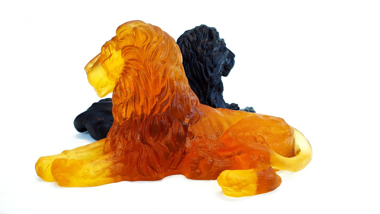 Lion 2 Premium Glass Sculptures Amber in front and Black in back looking in opposite directions