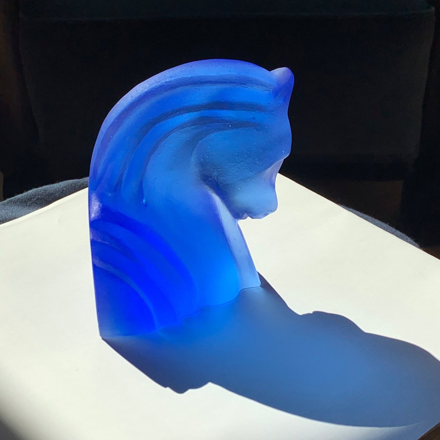 Hydra Horse Cast Glass Sculpture Blue on chair